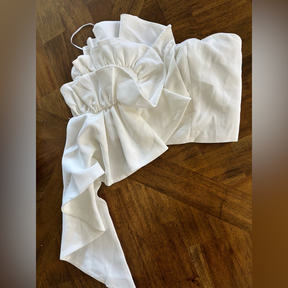 White top with ruffle detail.